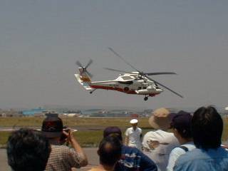 UH-60J flies-by.